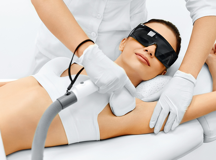 A woman getting a laser hair removal treatment