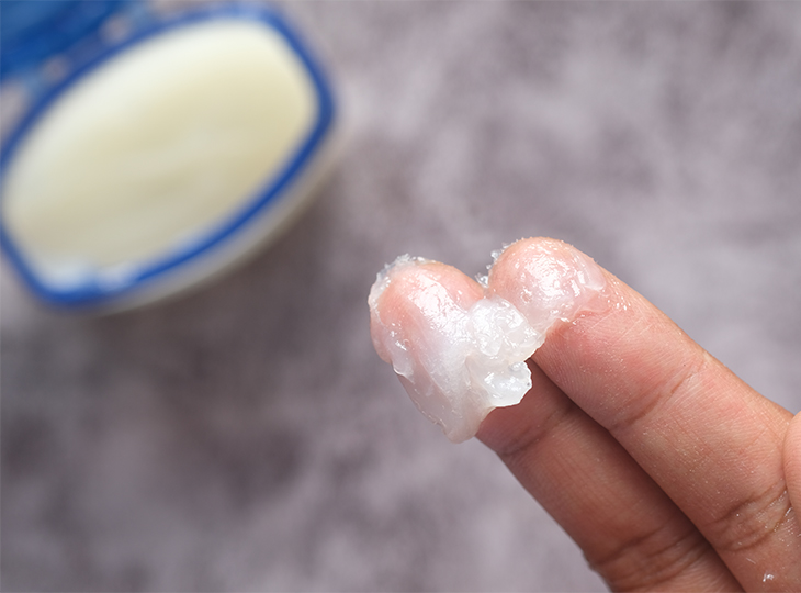 Man Putting on Petroleum Jelly