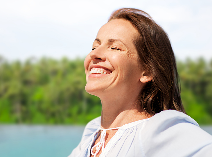 Woman smiling at the sun