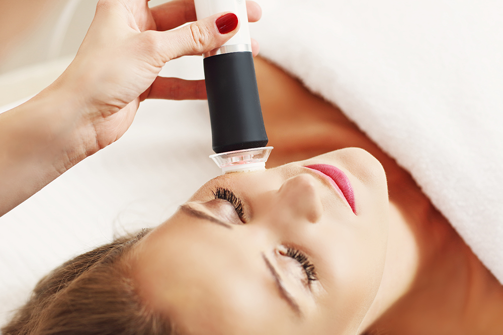 Woman Laying down Receiving OxyGeneo Treatment